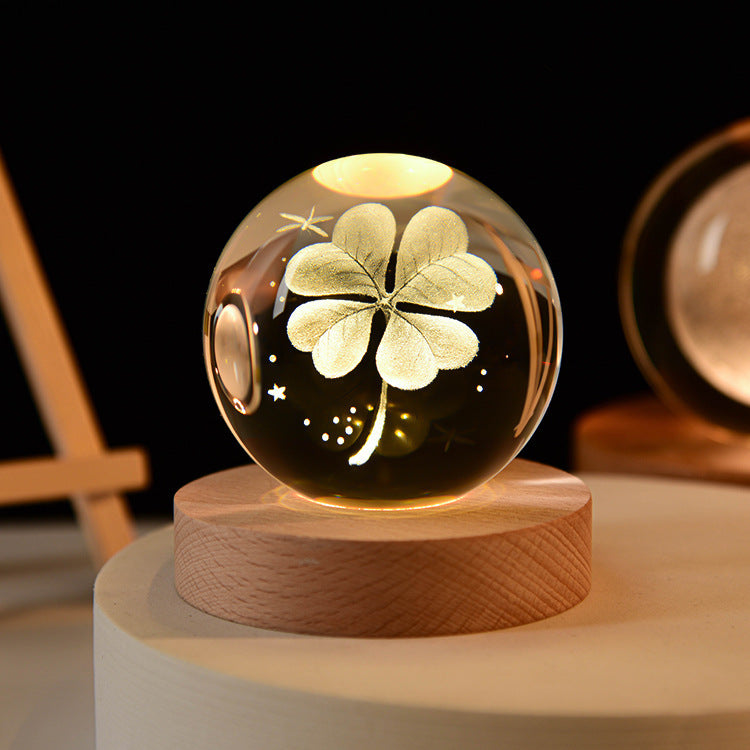 LED crystal ball night lamp with wooden base and glowing flower-style light pattern