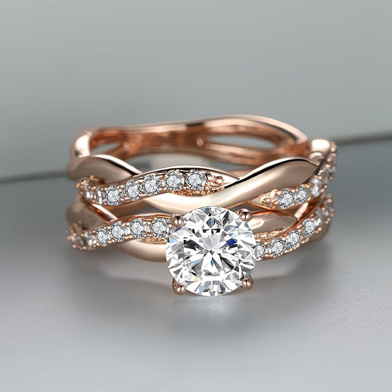 Rose gold women's ring with round zircon center and pavé bands