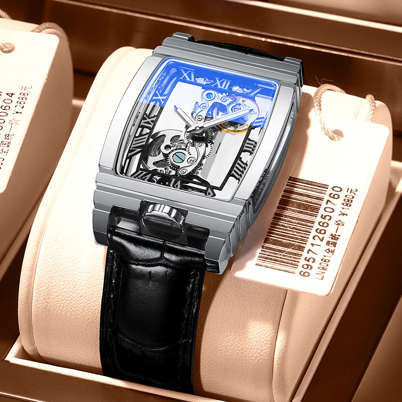 Skeleton mechanical watch in box: silver case, black leather strap, blue openwork dial