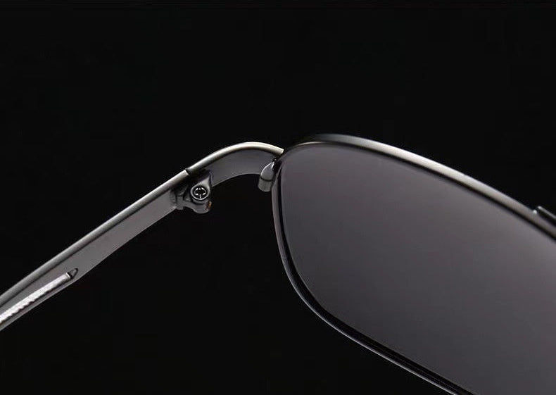 Polarized sunglasses close-up with silver metal frame and dark lens