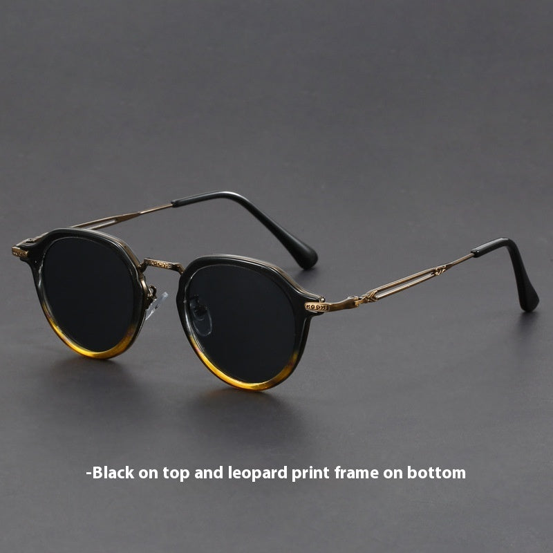 Unisex round metal sunglasses with black-and-gold striped frame and dark lenses