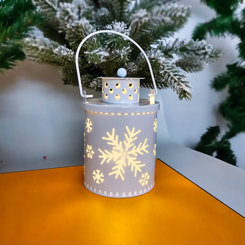 Gray LED lantern candle with snowflake cutouts and glowing candle light, curved handle