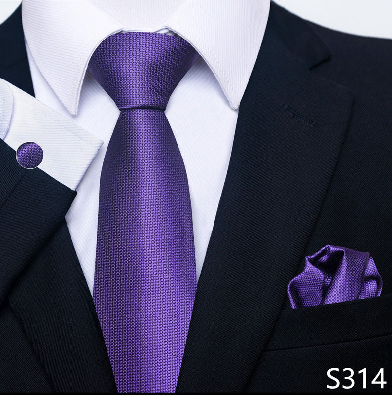 Purple solid-texture tie set with matching pocket square and round cuff links.