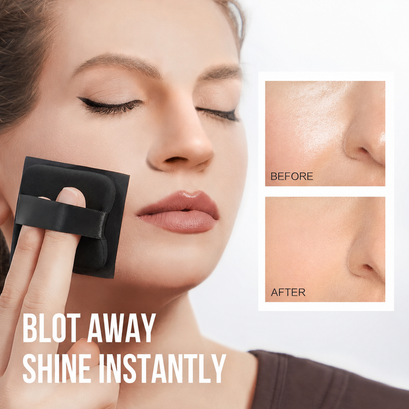Black powder puff pressed to a face for blotting shine