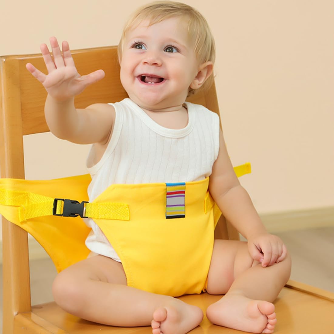 Yellow baby seat belt with wide front panel, striped center label and adjustable side buckles.
