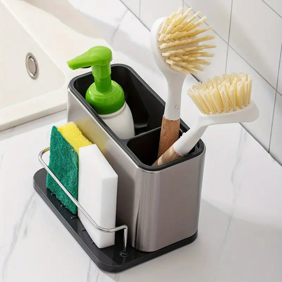 Stainless steel sink storage rack with compartments for soap, brushes, sponges, and a sponge holder