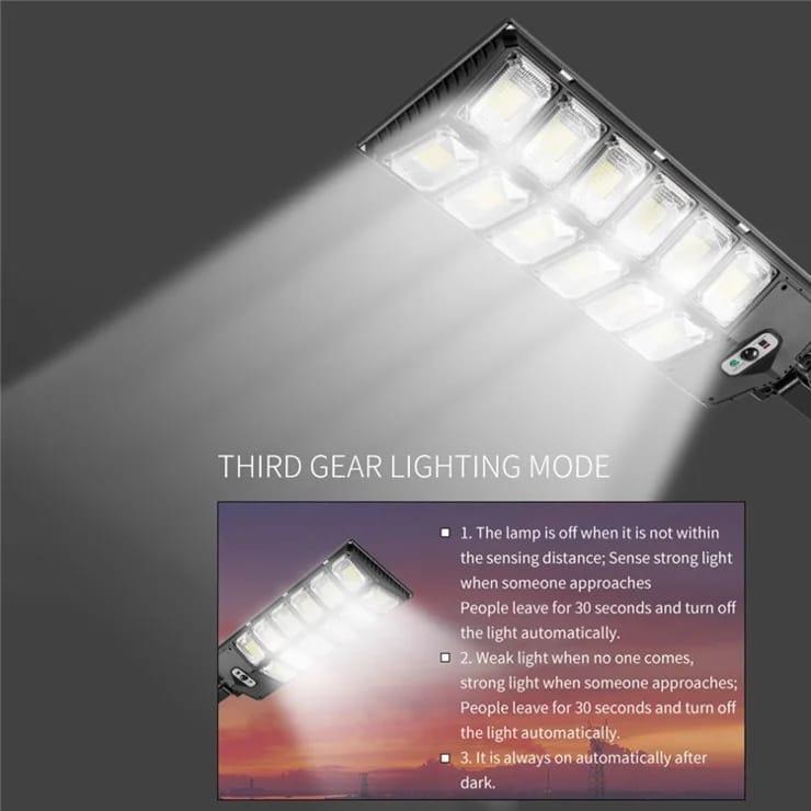 Solar sensor outdoor light projecting a wide beam in its third lighting mode.