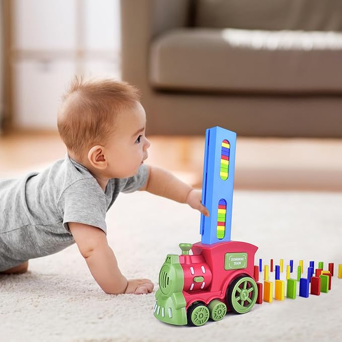 Automatic domino train set with a red and green locomotive, blue loading tower, and colorful dominoes