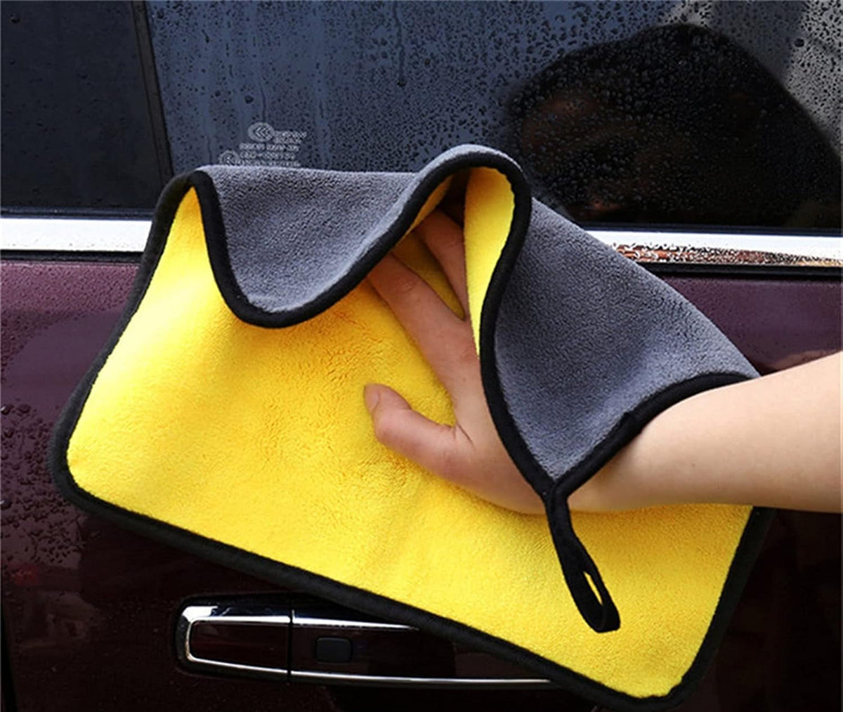 Yellow and gray microfiber cloth with black edging and a hanging loop
