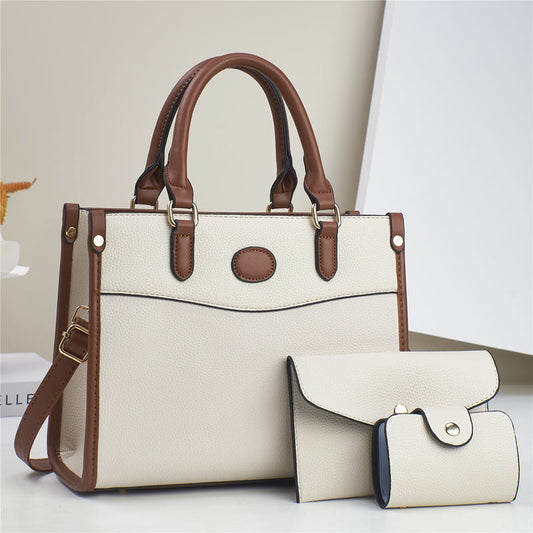 Three-piece shoulder bag set in off-white with brown trim: structured tote plus two pouches