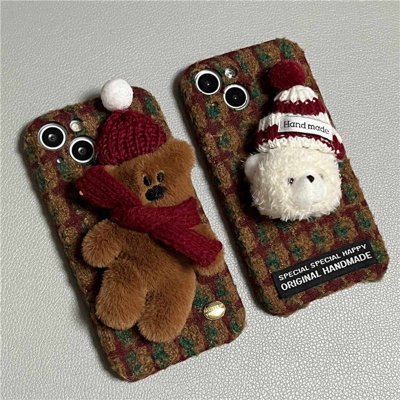 Two handmade plush plaid iPhone cases: brown teddy bear and white bear with knit hats