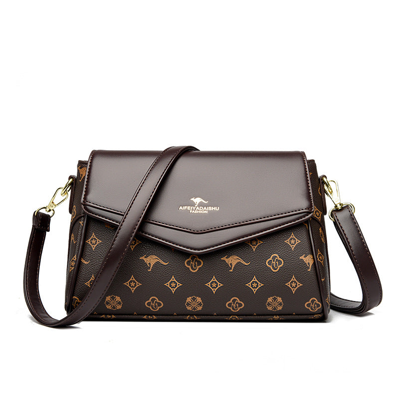 Dark brown monogram crossbody shoulder bag with taupe flap and gold-tone hardware