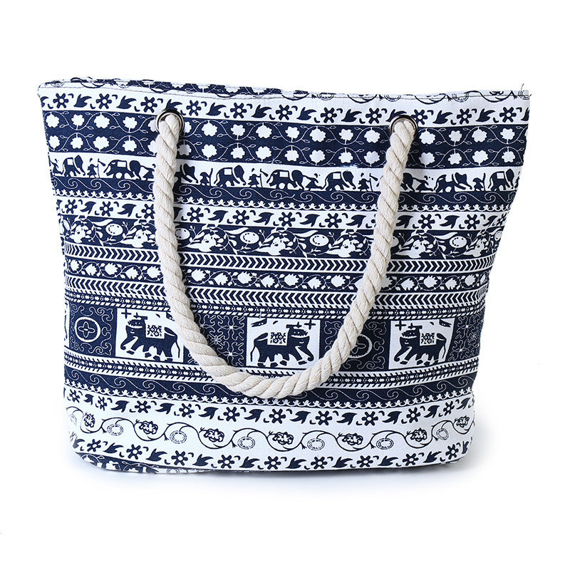Blue and white printed canvas tote bag with rope shoulder handles, open top
