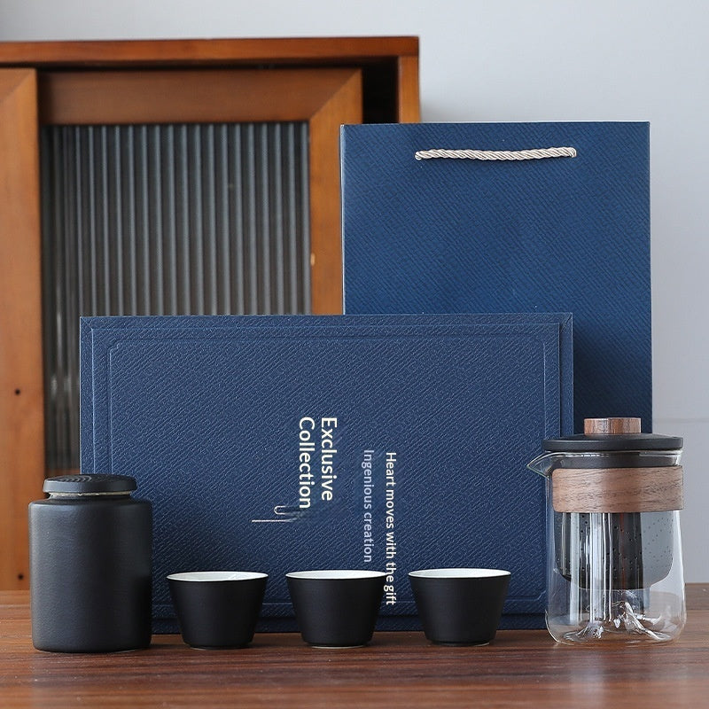 Black office gift set with dark notebook, pen, black tea cups, and tea pot tumbler
