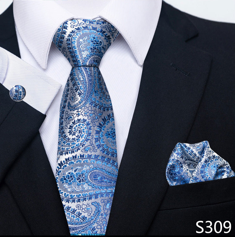 Blue paisley-style tie set with matching pocket square and round cuff links.