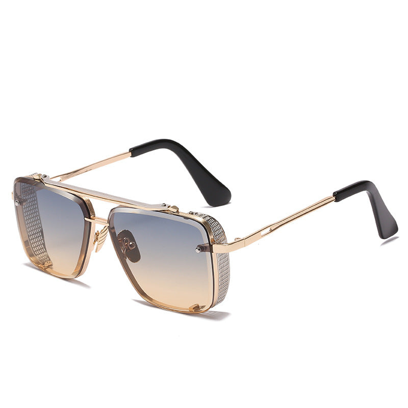 Gold-framed sunglasses with gradient lenses on a white background