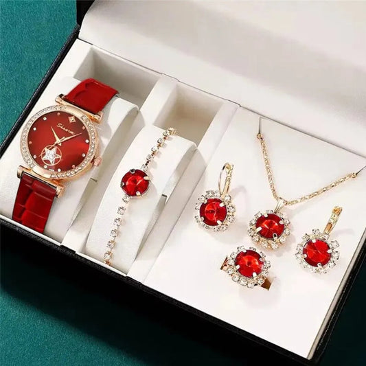 Jewelry set with a red watch and matching earrings and necklace in a box.