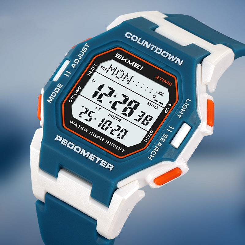 Close-up of the blue-and-white SKMEI digital watch face and orange side buttons