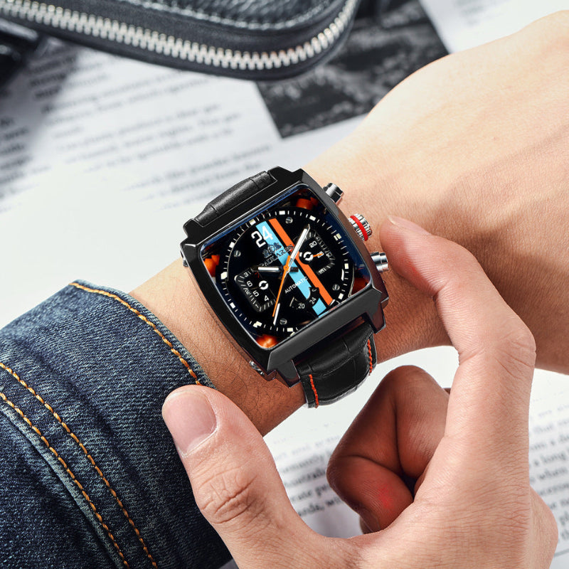 Person wearing a black smartwatch with a colorful display on a blurred background