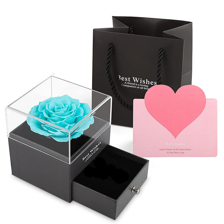 Acrylic jewelry gift box with light blue preserved rose in clear top cover