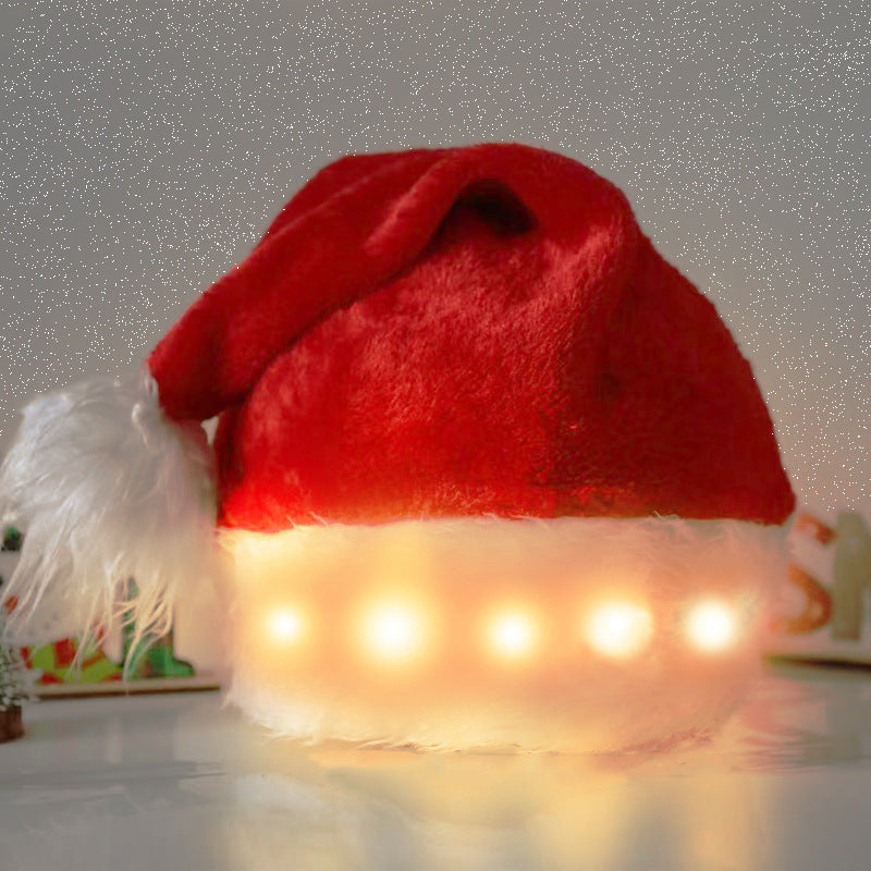 Red plush Santa hat with white brim and warm white LED light strip glow