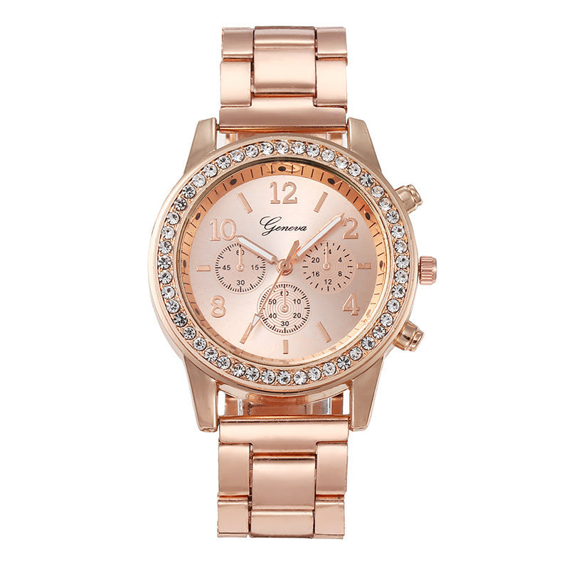 Rose gold watch with gemstone accents on a white background