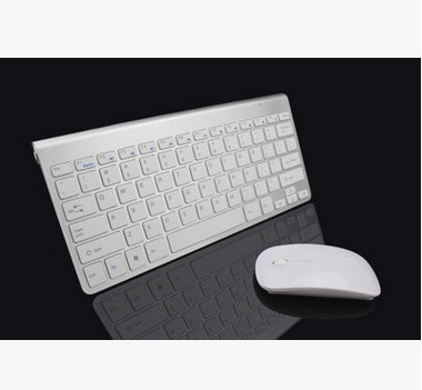 White keyboard and mouse set on a black background