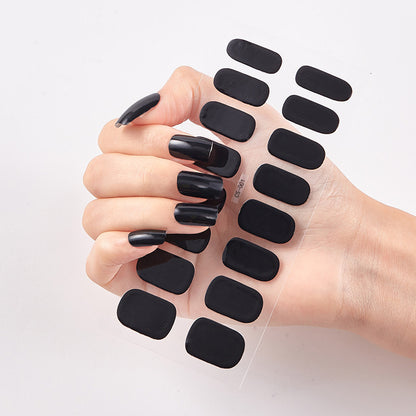 Hand with black nail wraps on a white background