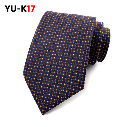 Navy blue tie with gold checkered pattern on a white background, featuring the brand 'YU-K17'.