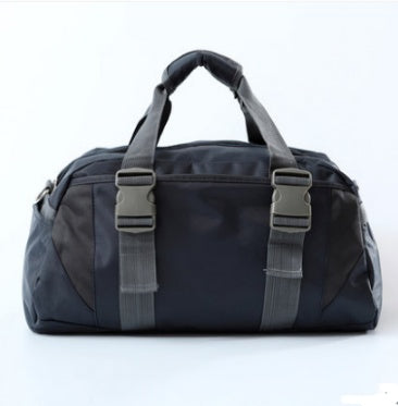 Yoga gym bag in dark blue with gray webbing straps and front zipper pocket