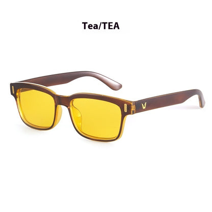 Sunglasses with yellow lenses and brown frame on a white background