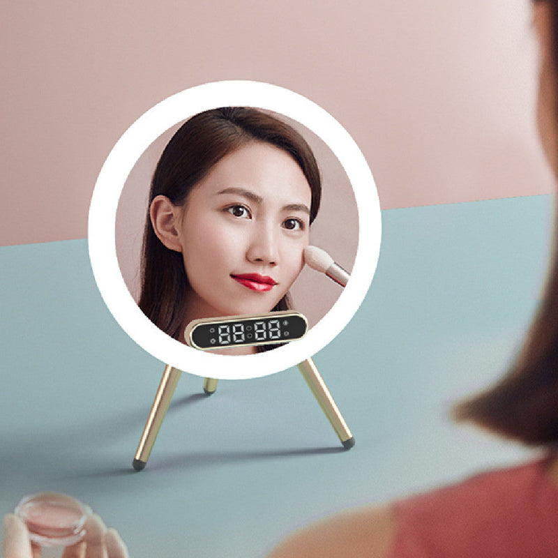 Woman applying makeup in front of a round mirror with a digital display on a light blue surface.