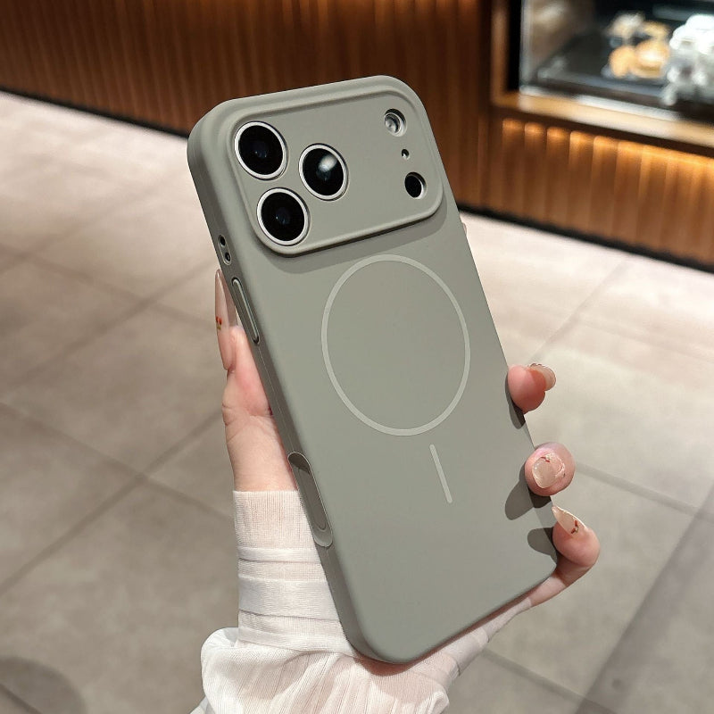 Person holding a light gray phone case with a minimalist design.