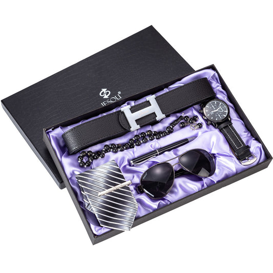 Men's gift set six-piece, black belt and watch in open decorative box with accessories.