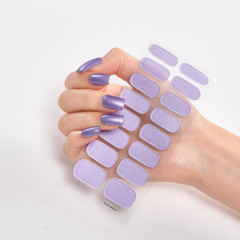 Hand with purple nail wraps on a white background