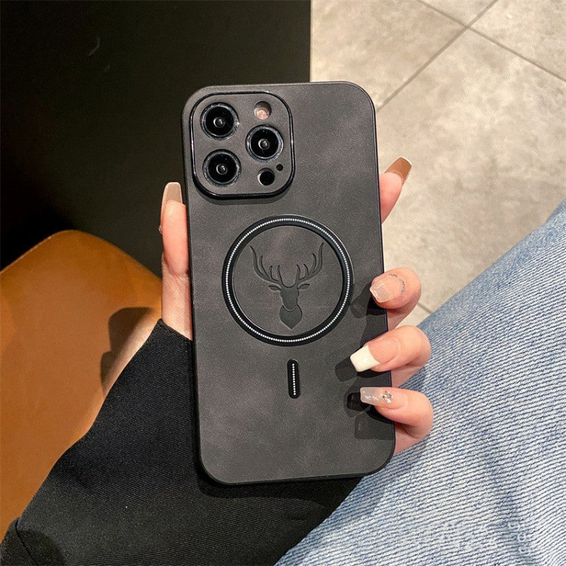 Person holding a black phone case with a deer emblem