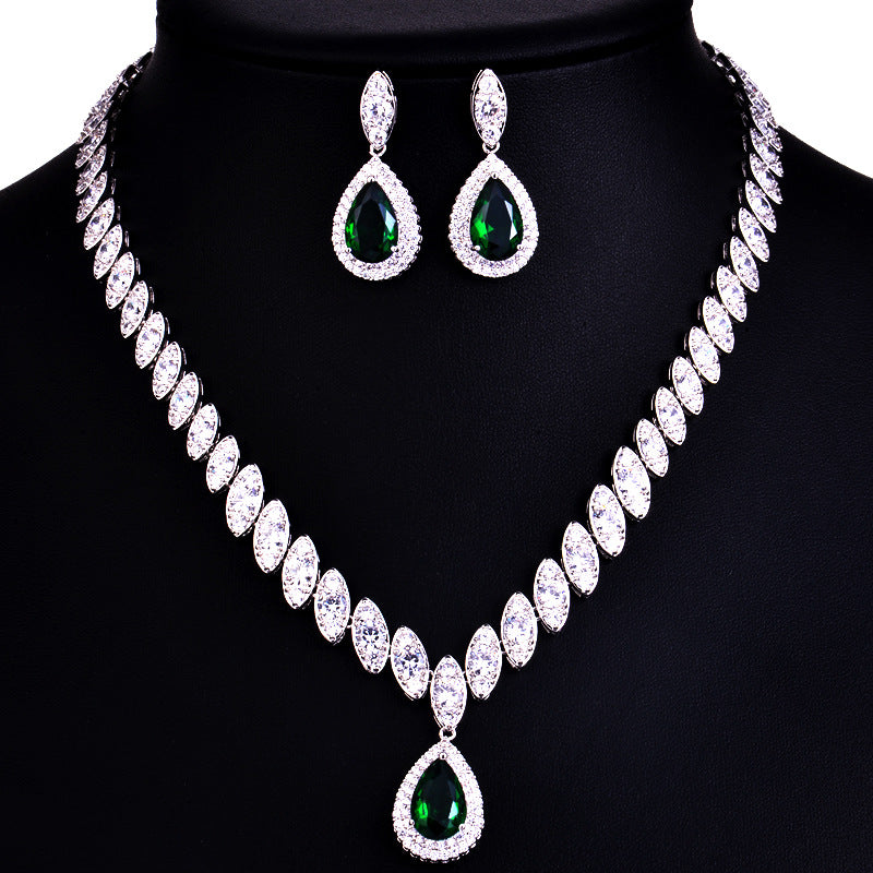 Jewelry set with necklace and earrings on a black background