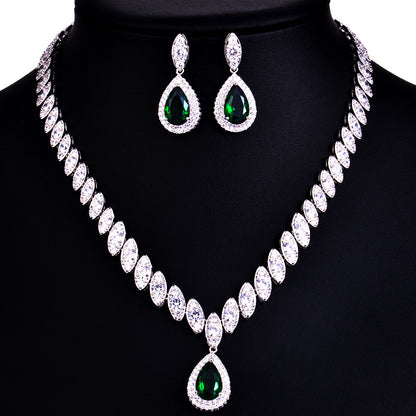 Jewelry set with necklace and earrings on a black background