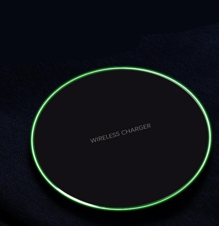 Wireless charger with green border on a black background