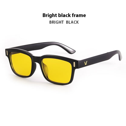Sunglasses with bright black frame and yellow lenses on a white background