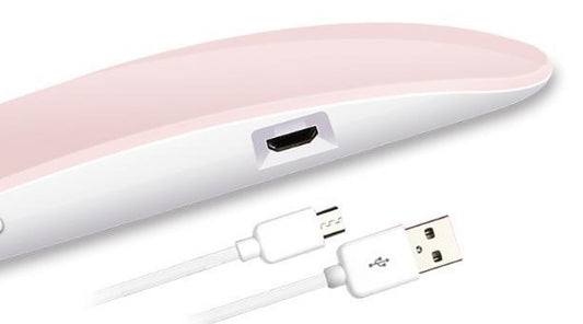 Pink Nail Drayer with USB cable on a white background