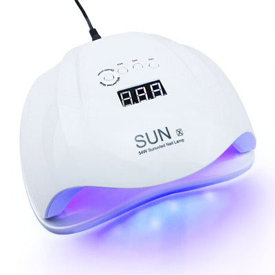 White nail lamp with blue light on a white background