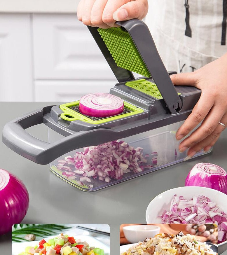 Vegetable chopper being used to chop onions with a person's hands, surrounded by chopped vegetables and a bowl of salad.