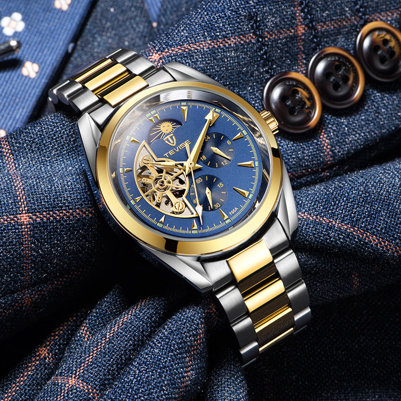 Two-tone men's mechanical watch with blue open-heart dial resting on patterned fabric