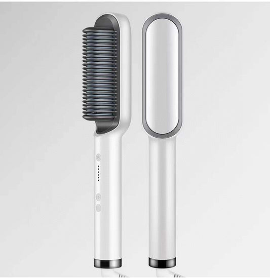 White hair straightening brush with black bristle side on a light gray background