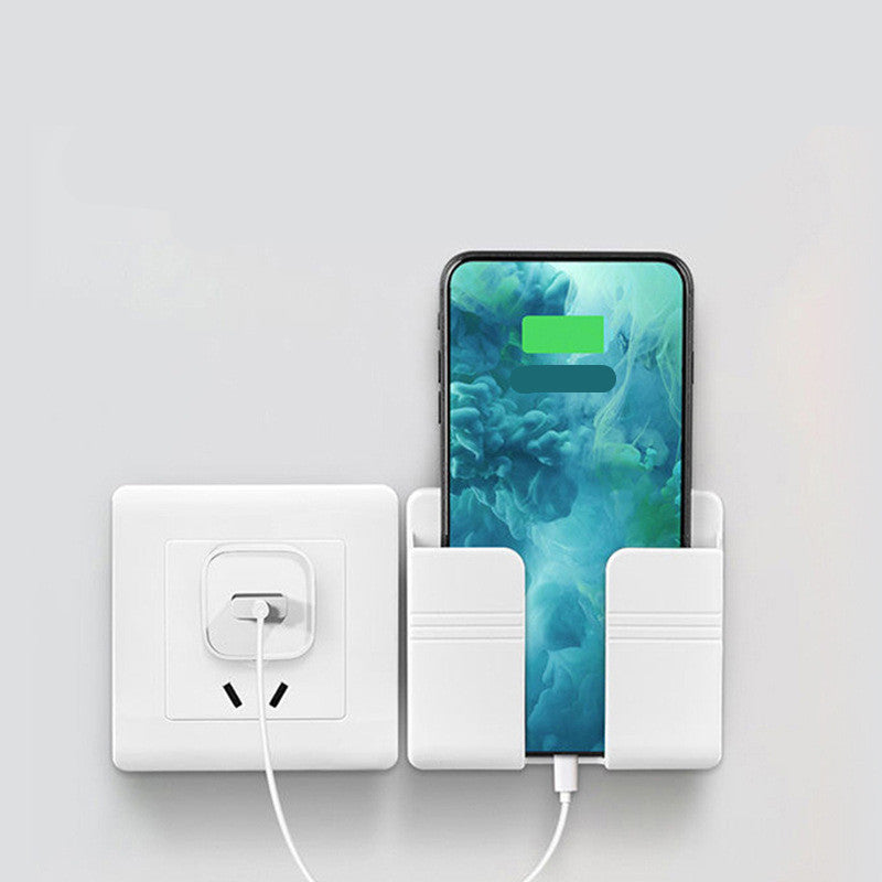 Phone charging station with smartphone and power outlet on a light gray background