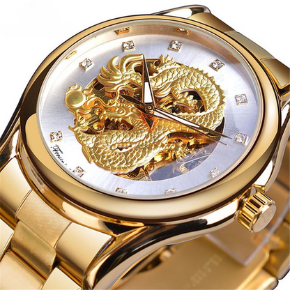 Gold wristwatch with dragon design on the face against a white background