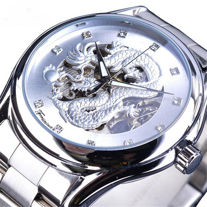Silver wristwatch with dragon design on the face against a white background