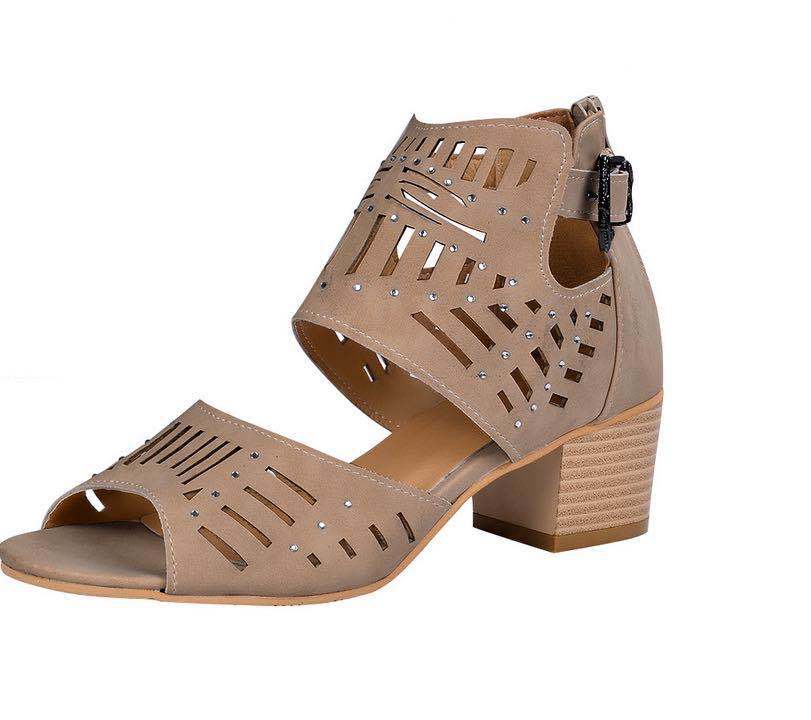 Beige sandal with cut-out design and block heel on a white background