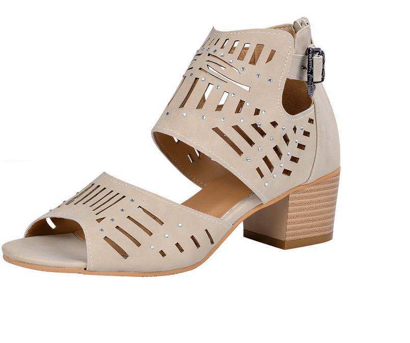 Beige sandal with cut-out design and block heel on a white background